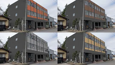 担当者がタブレットを使い住宅の外観カラーシミュレーションを説明している様子。机には塗料の色見本も並んでいる。